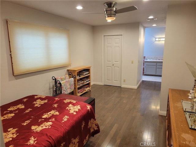 bedroom featuring ceiling fan and dark hardwood / wood-style flooring