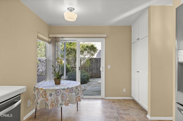 interior space with a healthy amount of sunlight and baseboards