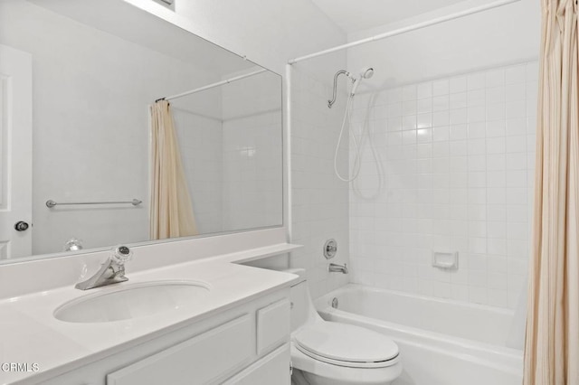 full bathroom featuring toilet, shower / bathtub combination with curtain, and vanity