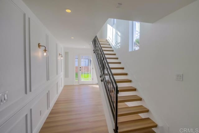 staircase featuring hardwood / wood-style floors