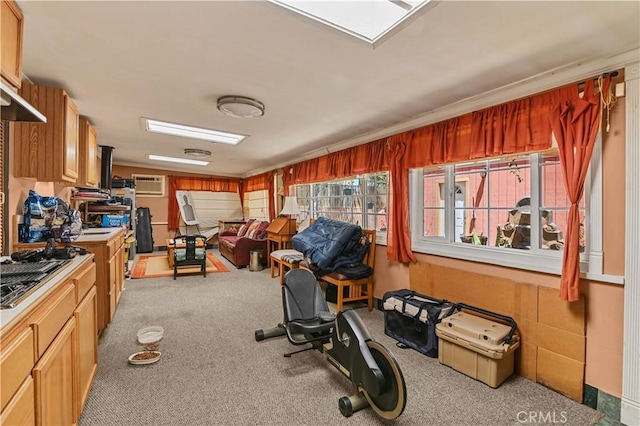 workout area with a wall mounted AC and light carpet