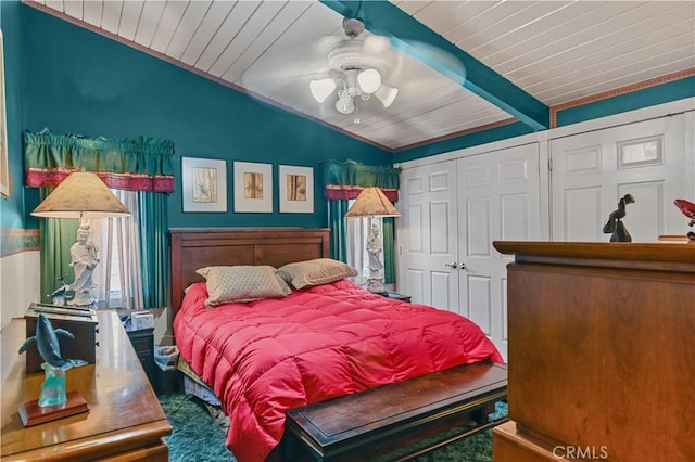 bedroom featuring wood ceiling, ceiling fan, a closet, and vaulted ceiling with beams