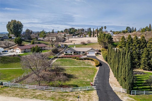 birds eye view of property with a rural view