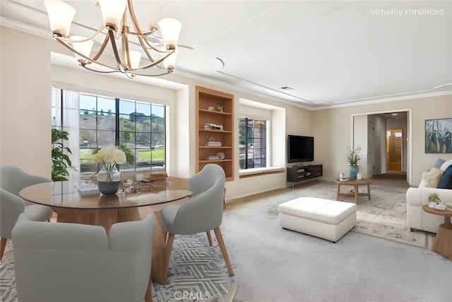 carpeted dining area with crown molding and an inviting chandelier