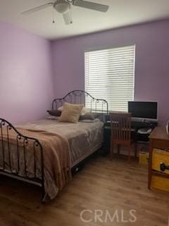 bedroom with wood-type flooring and ceiling fan