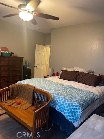 bedroom with wood-type flooring and ceiling fan