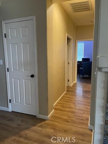 hallway featuring wood-type flooring