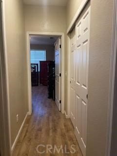 hallway featuring hardwood / wood-style flooring