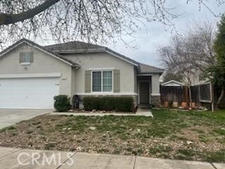 view of front of home with a garage and a front lawn