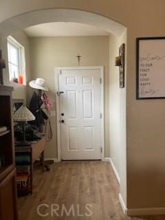 entryway with hardwood / wood-style floors