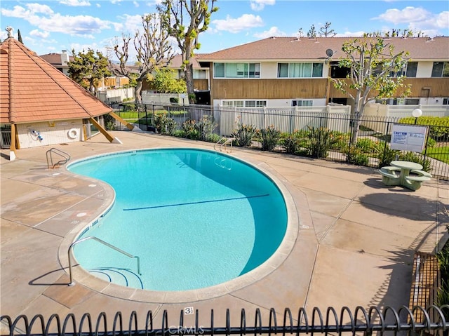 view of swimming pool featuring a patio area