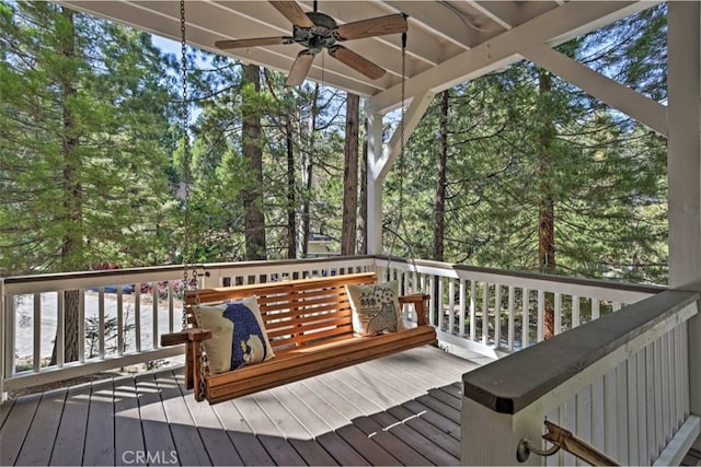 wooden terrace featuring ceiling fan