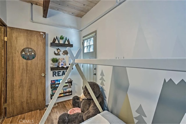 interior space with wood ceiling and hardwood / wood-style flooring