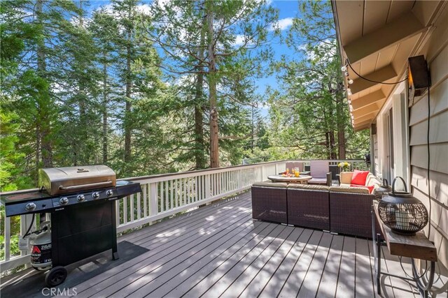 26619 Bel Air Ct, Lake Arrowhead, CA 92352 - wooden terrace featuring outdoor lounge area, grilling area, and view of wooded area
