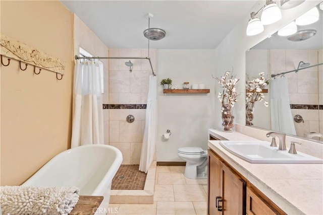 26619 Bel Air Ct, Lake Arrowhead, CA 92352 - full bathroom featuring vanity, a soaking tub, a tile shower, tile patterned floors, and toilet