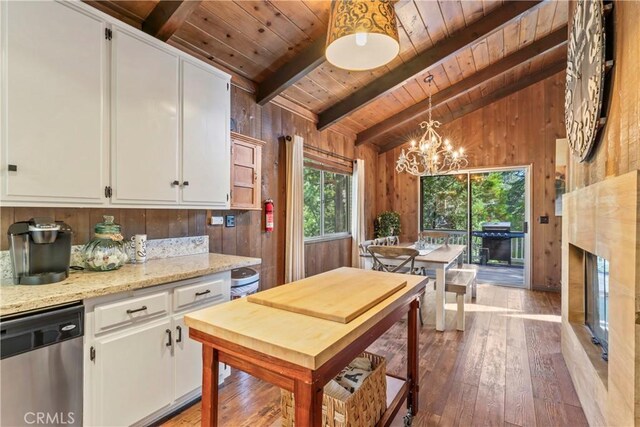 26619 Bel Air Ct, Lake Arrowhead, CA 92352 - kitchen with stainless steel dishwasher, wooden ceiling, light wood-style floors, white cabinets, and a chandelier