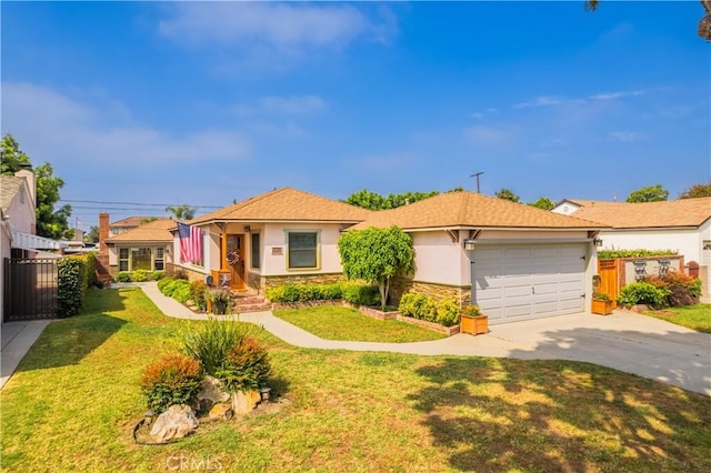 view of front of house featuring a garage and a front lawn