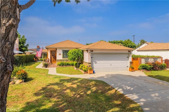 view of front facade with a garage and a front lawn