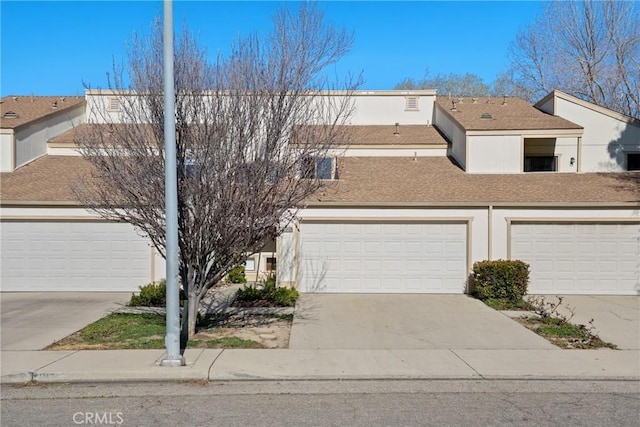 townhome / multi-family property featuring a garage