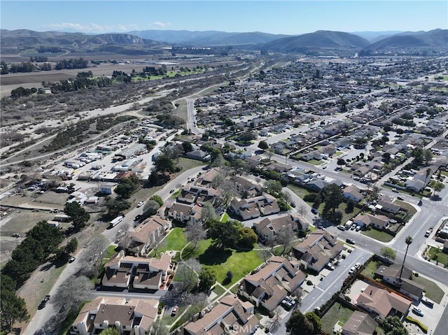 birds eye view of property with a mountain view