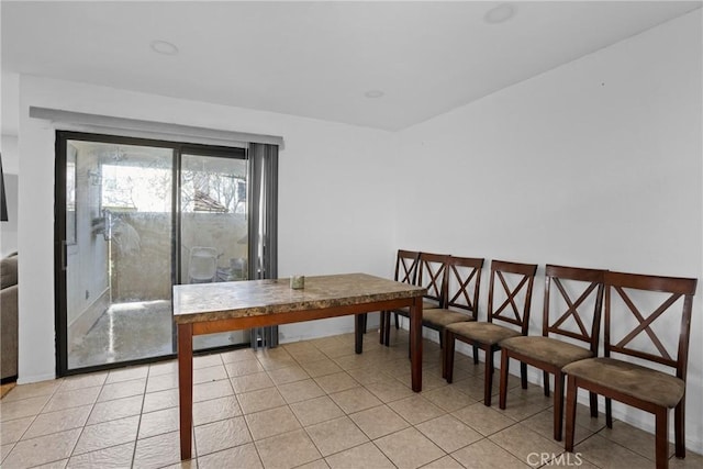 dining space with light tile patterned flooring