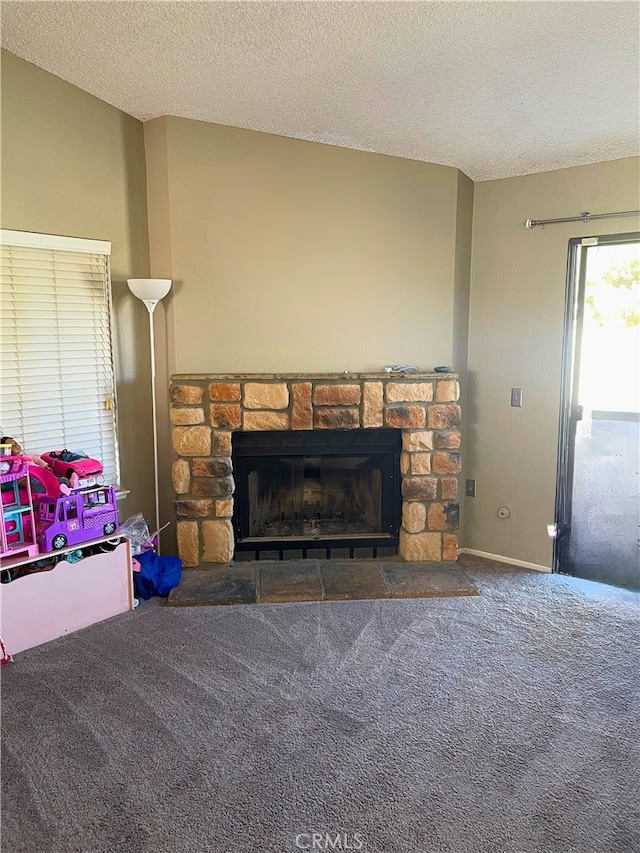 details featuring a fireplace, carpet floors, and a textured ceiling