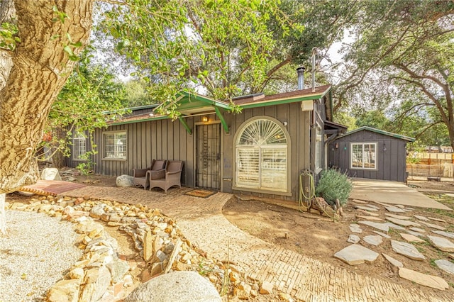 exterior space featuring a patio and a storage shed