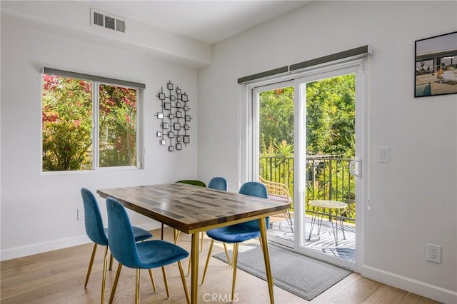 dining space featuring light hardwood / wood-style flooring