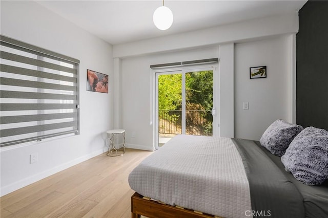 3822 Clayton Ave, Los Angeles, CA 90027 - bedroom featuring access to outside, baseboards, and wood finished floors