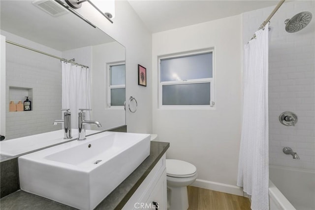 3822 Clayton Ave, Los Angeles, CA 90027 - bathroom with vanity, toilet, shower / bathtub combination with curtain, visible vents, and wood finished floors