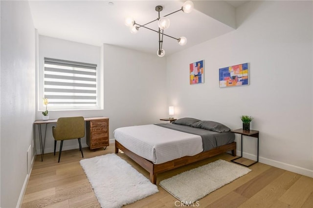 3822 Clayton Ave, Los Angeles, CA 90027 - bedroom with baseboards and wood finished floors
