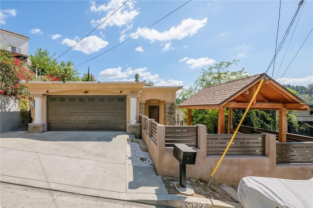 view of front of home with a gazebo and a garage