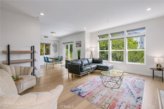 3822 Clayton Ave, Los Angeles, CA 90027 - living area with light wood finished floors, baseboards, visible vents, and recessed lighting