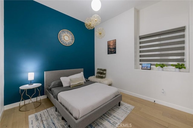 bedroom featuring wood-type flooring