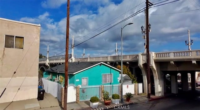 view of building exterior with a fenced front yard