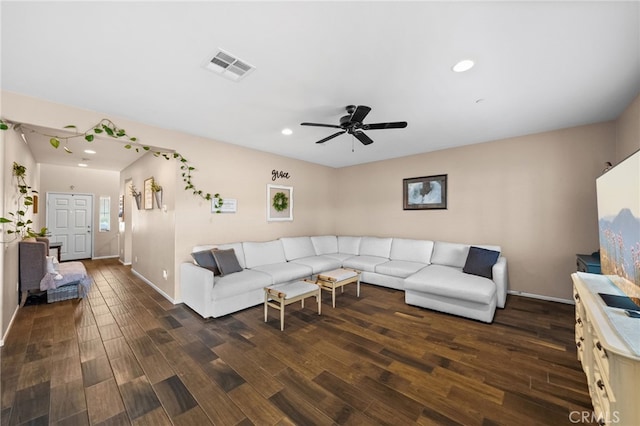 living room featuring dark hardwood / wood-style floors and ceiling fan