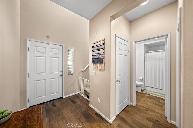 foyer entrance with dark hardwood / wood-style flooring