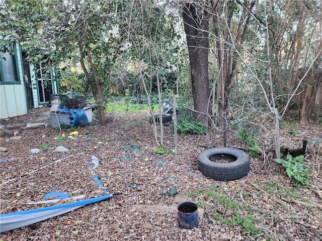 view of yard with an outdoor fire pit