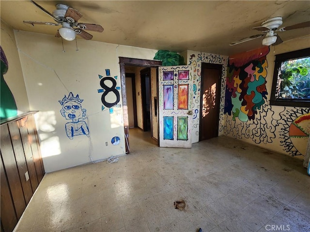 interior space featuring ceiling fan