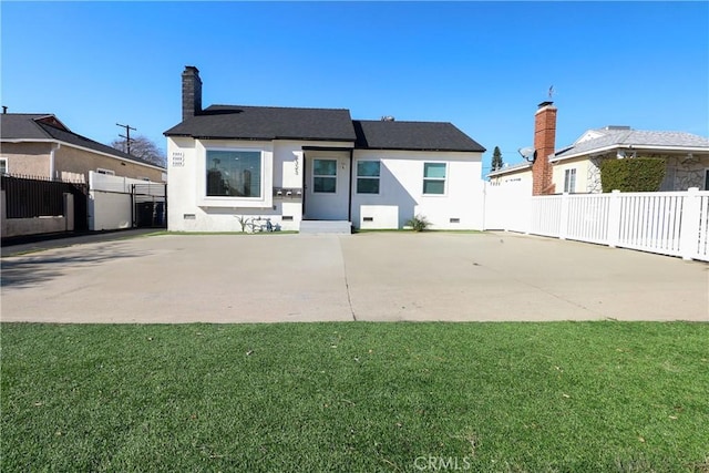 back of property with a patio and a lawn