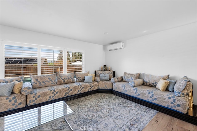 1320 W Fern Ave, Redlands, CA 92373 - living room with an AC wall unit and wood finished floors