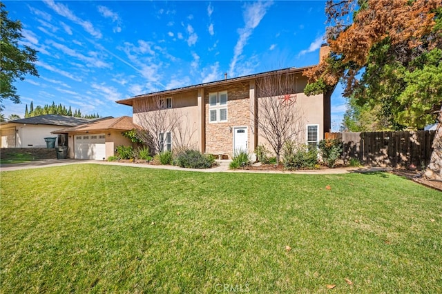1320 W Fern Ave, Redlands, CA 92373 - view of front of house with fence, a garage, a front lawn, and stone siding