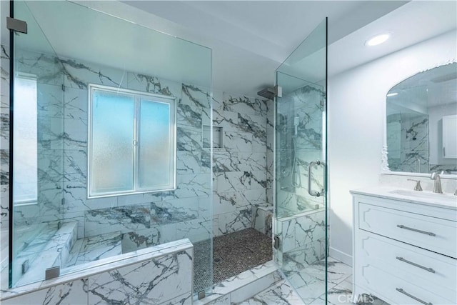 bathroom with vanity and a shower with shower door