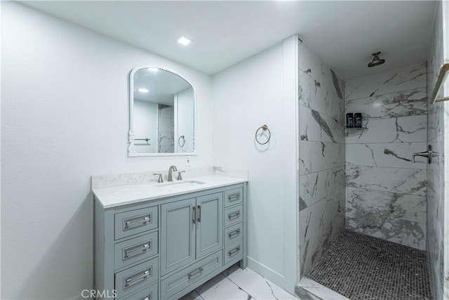 bathroom featuring vanity and a tile shower