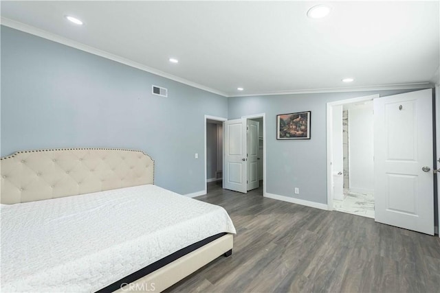 bedroom featuring ornamental molding, dark hardwood / wood-style floors, and ensuite bathroom