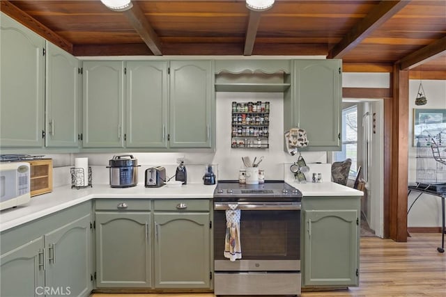 interior space with light wood-style floors, beamed ceiling, wood ceiling, and stainless steel range with electric cooktop