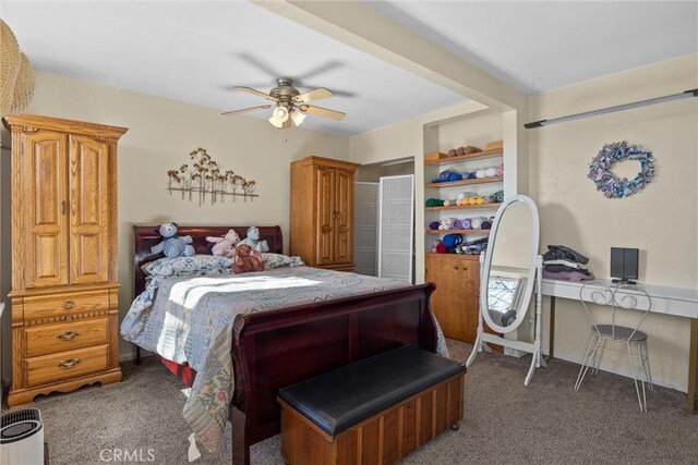 bedroom with dark carpet and a ceiling fan