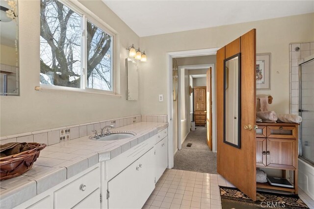 full bathroom with tile patterned flooring and vanity