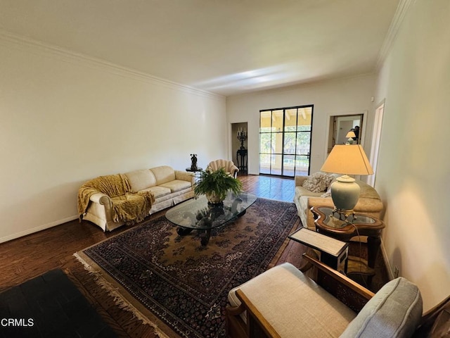 living room with crown molding, baseboards, and wood-type flooring