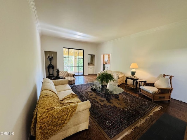 living room featuring baseboards, crown molding, and dark wood-style floors